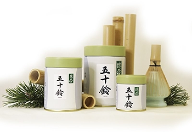 3 cans of Isuzu matcha and a whisk