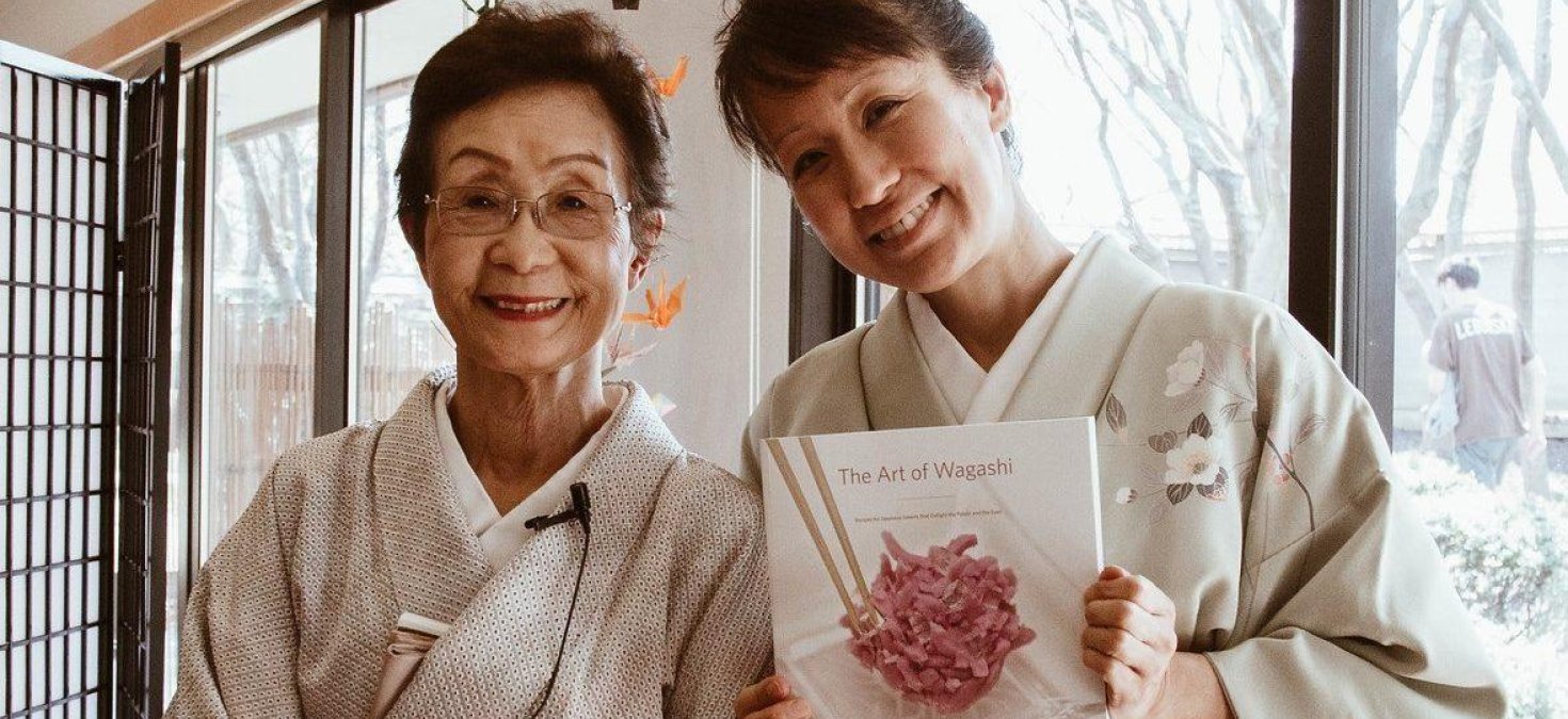 Kimiko Gunji and Jennifer Gunji-Ballsrud holding the Art of Wagashi book